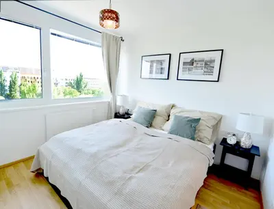 Ein Bett oder Betten in einem Zimmer der Unterkunft Erdberger Lände