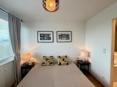 Ein Bett oder Betten in einem Zimmer der Unterkunft Erdberger Lände