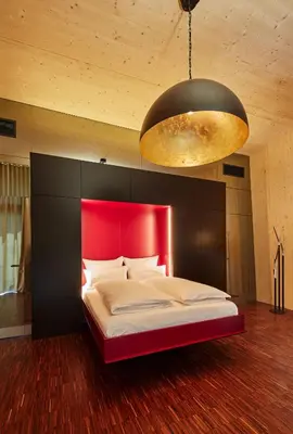 Ein Bett oder Betten in einem Zimmer der Unterkunft Gartenlofts auf Gut Guntrams