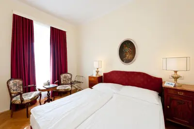 Ein Bett oder Betten in einem Zimmer der Unterkunft Hotel Regina
