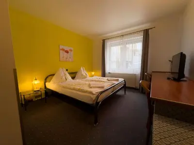 Ein Bett oder Betten in einem Zimmer der Unterkunft Pension Erlaa