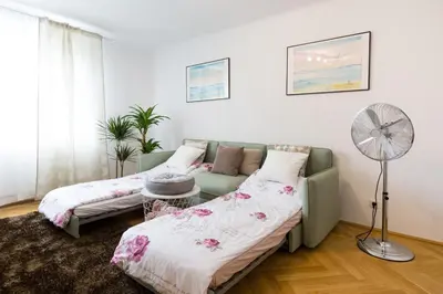 Ein Bett oder Betten in einem Zimmer der Unterkunft Apartment Rudolfsplatz