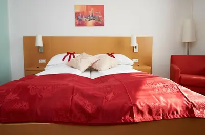 Ein Bett oder Betten in einem Zimmer der Unterkunft City-Hotel Mödling
