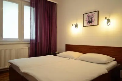 Ein Bett oder Betten in einem Zimmer der Unterkunft govienna - Messe Wien Apartment
