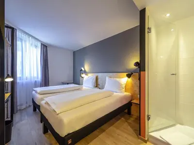Ein Bett oder Betten in einem Zimmer der Unterkunft ibis Styles Wien Messe Prater