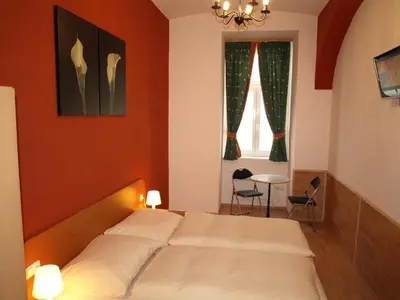 Ein Bett oder Betten in einem Zimmer der Unterkunft Pension Tal Studios
