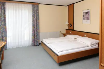 Ein Bett oder Betten in einem Zimmer der Unterkunft Landgasthof Hotel Muhr