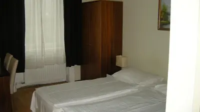 Ein Bett oder Betten in einem Zimmer der Unterkunft Pension Schottentor