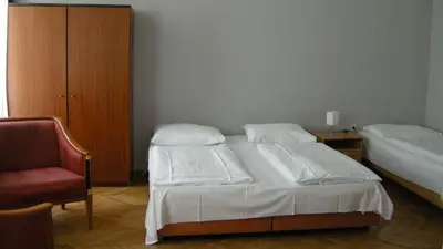 Ein Bett oder Betten in einem Zimmer der Unterkunft Pension Schottentor