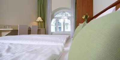 Ein Bett oder Betten in einem Zimmer der Unterkunft Hotel Wandl
