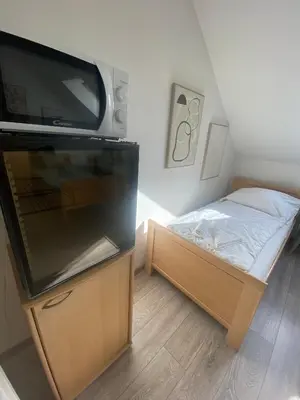 Ein Bett oder Betten in einem Zimmer der Unterkunft Pension Lizzi