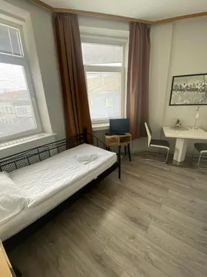 Ein Bett oder Betten in einem Zimmer der Unterkunft Pension Lizzi