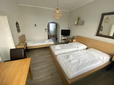 Ein Bett oder Betten in einem Zimmer der Unterkunft Pension Lizzi