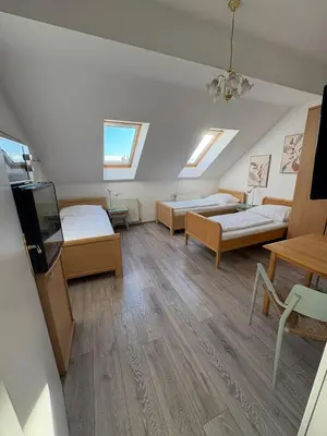 Ein Bett oder Betten in einem Zimmer der Unterkunft Pension Lizzi