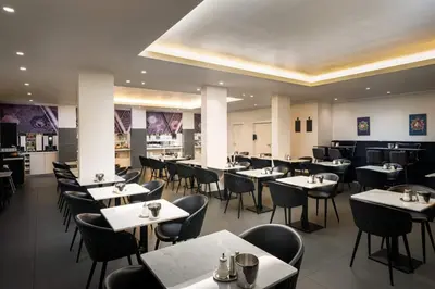 Ein Restaurant oder anderes Speiselokal in der Unterkunft elaya hotel vienna city west, Trademark by Wyndham