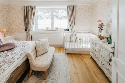 Ein Bett oder Betten in einem Zimmer der Unterkunft OLEANDER SUITEN großzügig wohnen mit besonderem Charme