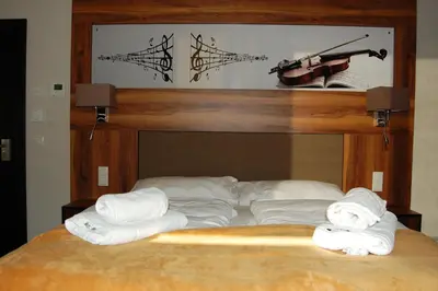 Ein Bett oder Betten in einem Zimmer der Unterkunft Apollo Hotel Vienna