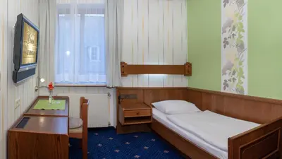 Ein Bett oder Betten in einem Zimmer der Unterkunft Pension Wienerstub'n