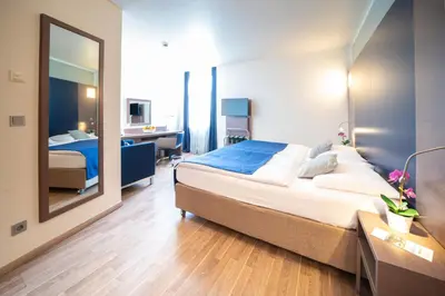 Ein Bett oder Betten in einem Zimmer der Unterkunft Hotel Orangerie