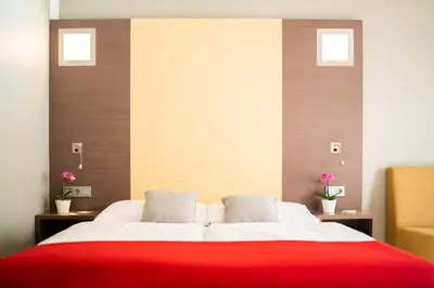 Ein Bett oder Betten in einem Zimmer der Unterkunft Hotel Orangerie
