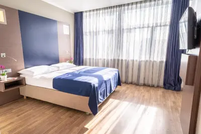 Ein Bett oder Betten in einem Zimmer der Unterkunft Hotel Orangerie
