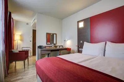 Ein Bett oder Betten in einem Zimmer der Unterkunft Hotel Orangerie