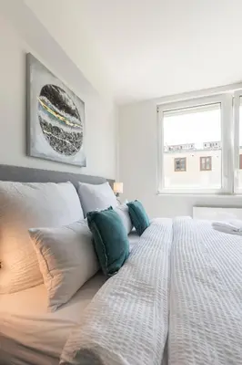 Ein Bett oder Betten in einem Zimmer der Unterkunft Cube Apartments by Wiener Stadthalle & U3 Metro