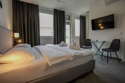 Ein Bett oder Betten in einem Zimmer der Unterkunft Cube Apartments by Wiener Stadthalle & U3 Metro