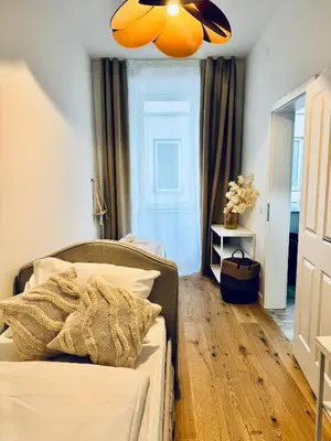 Ein Bett oder Betten in einem Zimmer der Unterkunft Vienna Experience