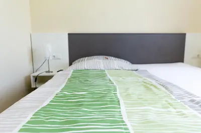 Ein Bett oder Betten in einem Zimmer der Unterkunft Gästehaus Krause