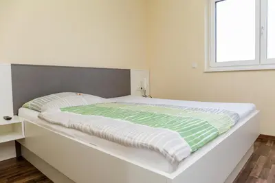 Ein Bett oder Betten in einem Zimmer der Unterkunft Gästehaus Krause