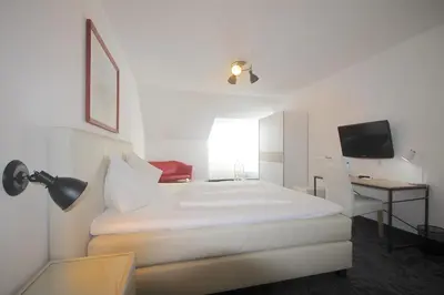 Ein Bett oder Betten in einem Zimmer der Unterkunft Hotel Altmann