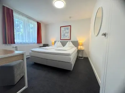 Ein Bett oder Betten in einem Zimmer der Unterkunft Hotel Altmann