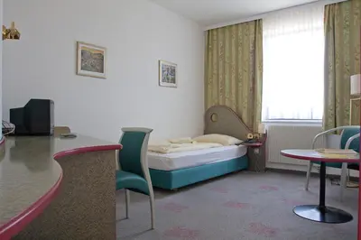 Ein Bett oder Betten in einem Zimmer der Unterkunft Seminarhotel Göttlesbrunn