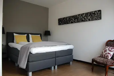 Ein Bett oder Betten in einem Zimmer der Unterkunft Kunsthaus Apartments