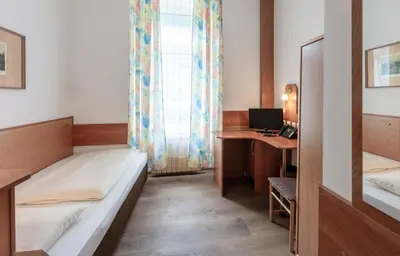 Ein Bett oder Betten in einem Zimmer der Unterkunft Hotel Admiral