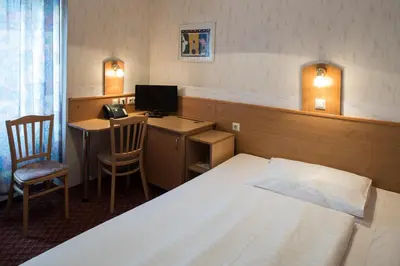 Ein Bett oder Betten in einem Zimmer der Unterkunft Hotel Admiral