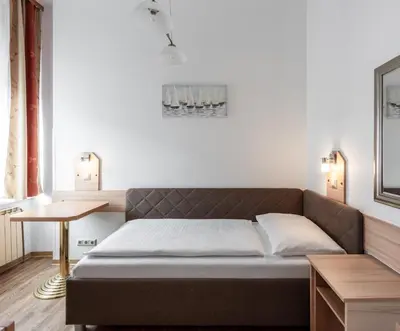 Ein Bett oder Betten in einem Zimmer der Unterkunft Hotel Admiral