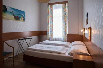 Ein Bett oder Betten in einem Zimmer der Unterkunft Hotel Admiral
