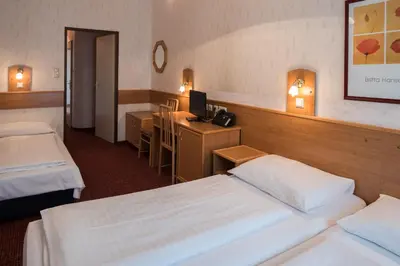 Ein Bett oder Betten in einem Zimmer der Unterkunft Hotel Admiral