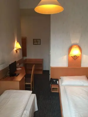 Ein Bett oder Betten in einem Zimmer der Unterkunft Hotel Admiral