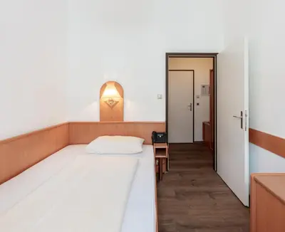 Ein Bett oder Betten in einem Zimmer der Unterkunft Hotel Admiral