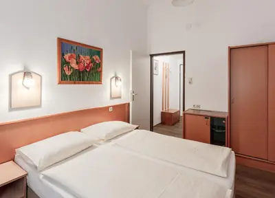 Ein Bett oder Betten in einem Zimmer der Unterkunft Hotel Admiral