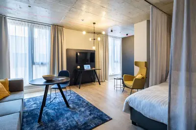 Ein Bett oder Betten in einem Zimmer der Unterkunft Adina Serviced Apartments Vienna