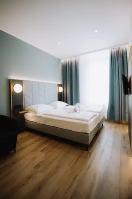 Ein Bett oder Betten in einem Zimmer der Unterkunft Florum Hotel