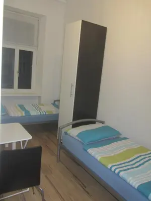 Ein Bett oder Betten in einem Zimmer der Unterkunft FEWO Pazmaniten