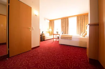Ein Bett oder Betten in einem Zimmer der Unterkunft Hotel Beethoven