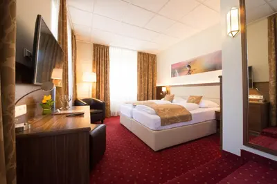Ein Bett oder Betten in einem Zimmer der Unterkunft Hotel Beethoven