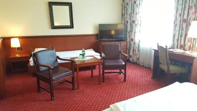 Ein Bett oder Betten in einem Zimmer der Unterkunft Landhotel Jagdhof