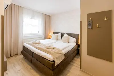 Ein Bett oder Betten in einem Zimmer der Unterkunft Winzerhof Lentsch